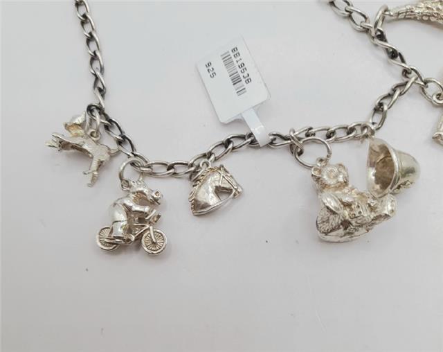925 silver charm bracelet weighing 27.3g with intricate charms, unbranded jewelry accessory for women.