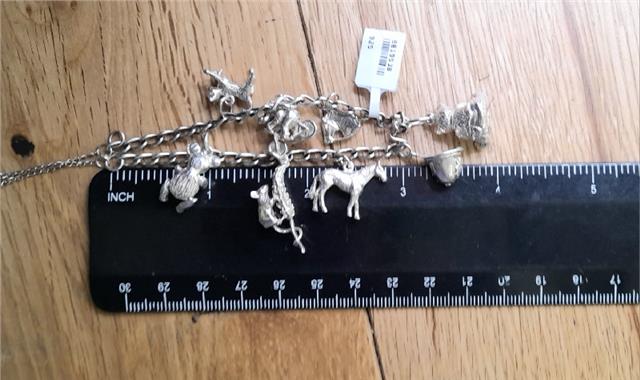 925 silver charm bracelet with intricate details, weighing 27.3g, unbranded jewelry accessory for stylish wear