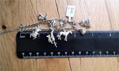 925 silver charm bracelet with intricate details, weighing 27.3g, unbranded jewelry accessory for stylish wear