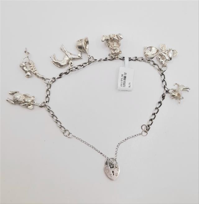 925 silver charm bracelet weighing 27.3g, unbranded jewelry accessory with intricate charm details on a classic bracelet style.