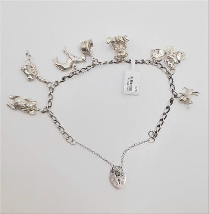 925 silver charm bracelet weighing 27.3g, unbranded jewelry accessory with intricate charm details on a classic bracelet style.