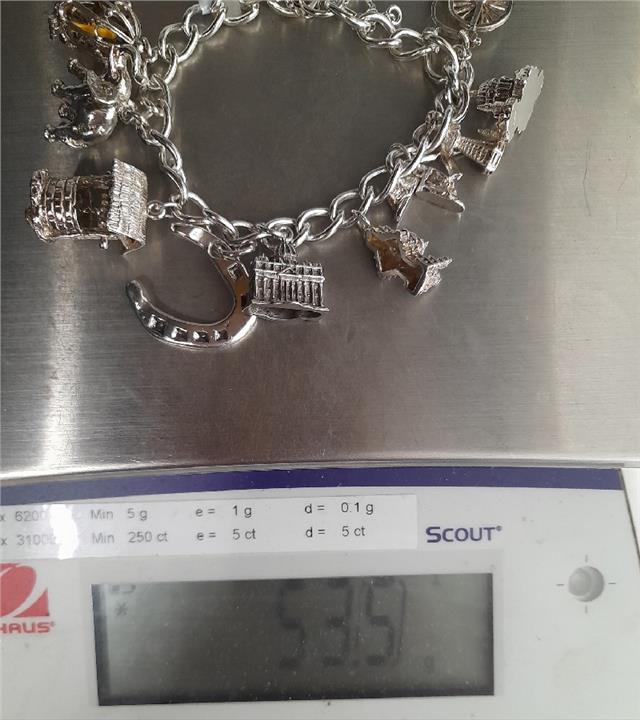 925 silver charm bracelet, 7-inch unbranded jewelry piece with intricate charm details and a weight of 53.6 grams.