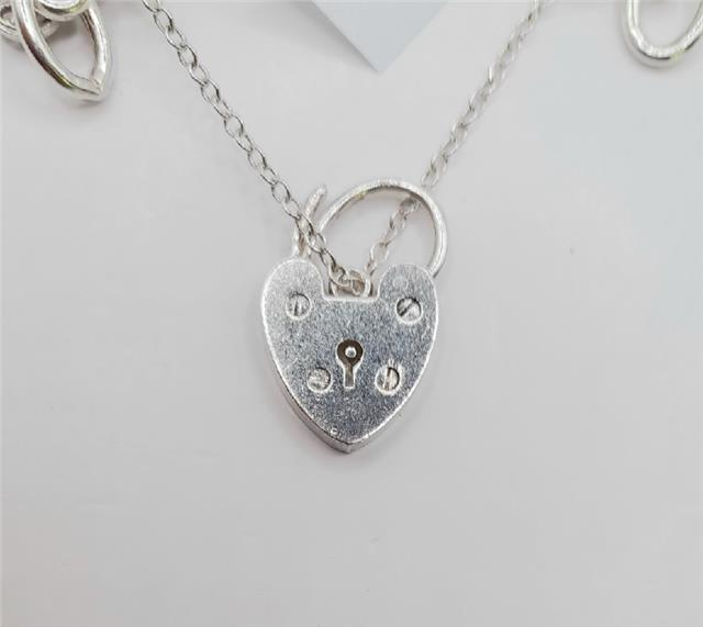925 silver charm bracelet weighing 53.6g, 7-inch length, unbranded jewelry with decorative charms on a silver bracelet.