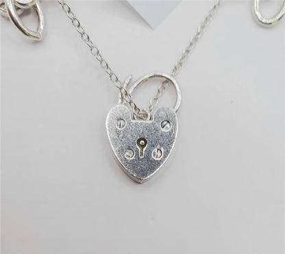 925 silver charm bracelet weighing 53.6g, 7-inch length, unbranded jewelry with decorative charms on a silver bracelet.