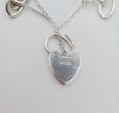 925 silver charm bracelet weighing 53.6g, 7-inch length, unbranded jewelry with decorative charms and detailed silver craftsmanship.