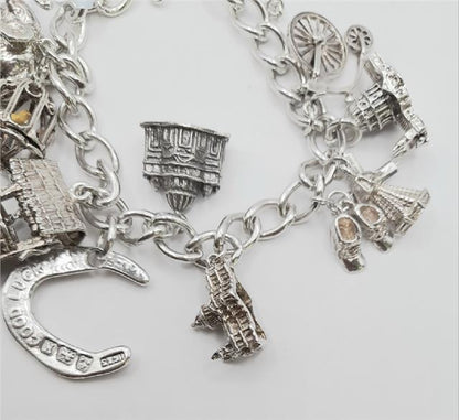 925 silver charm bracelet weighing 53.6g, 7-inch unbranded bracelet with detailed charm designs on a white background.