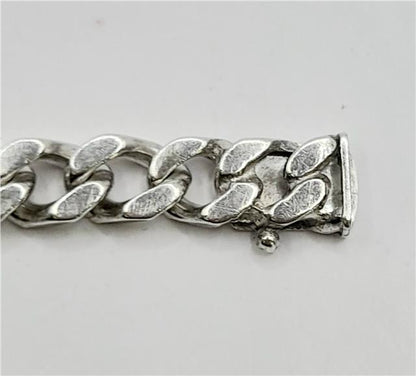 925 silver curb bracelet weighing 37.9g and 24cm long, featuring a classic chain link design.