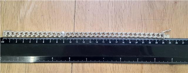 925 silver curb bracelet weighing 37.9g and measuring 24cm, featuring a classic chain design with a polished finish.