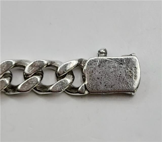 925 silver curb bracelet with a 24cm length and 37.9g weight, showcasing a sleek, polished design.