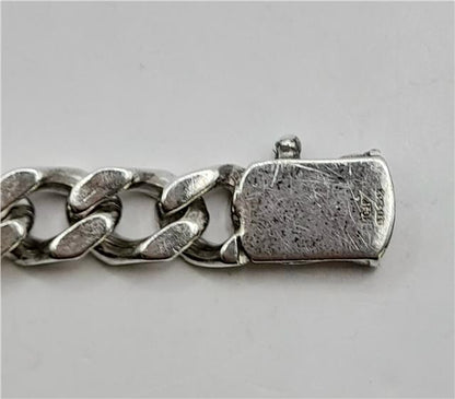 925 silver curb bracelet with a 24cm length and 37.9g weight, showcasing a sleek, polished design.