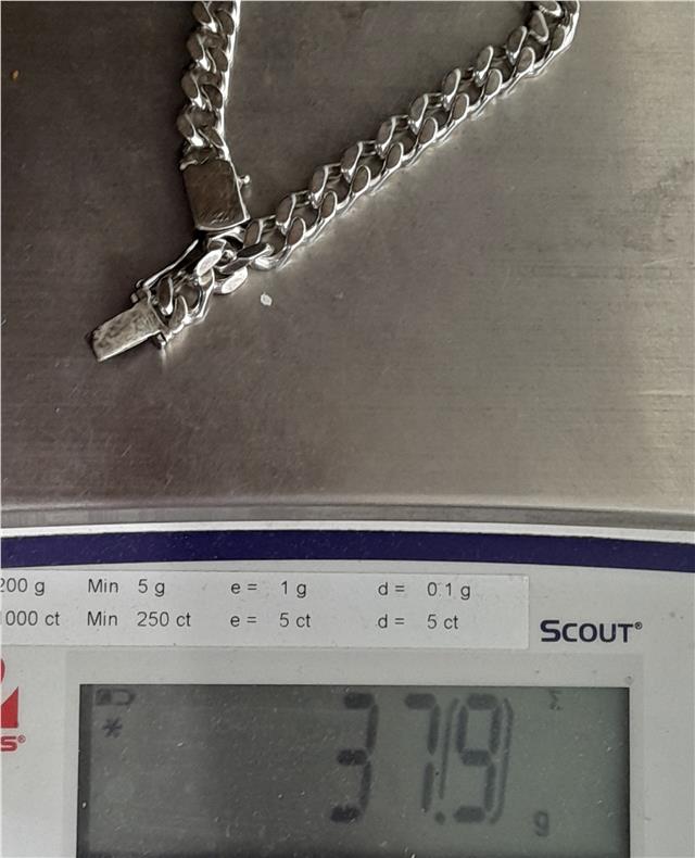 925 silver curb bracelet, unbranded, 24cm length, 37.9g, detailed chain design, worn on wrist in close-up image.