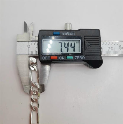 925 silver Figaro chain, 18 inches long, showcasing shiny linked design and solid weight of 37.7 grams.