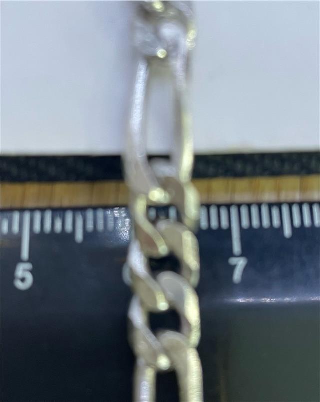 925 silver Figaro chain with polished links, showcasing its elegant design and shiny finish.