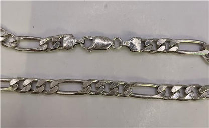 925 silver figaro chain, unbranded, showing a close-up of the elegant, polished chain with distinctive flattened links.