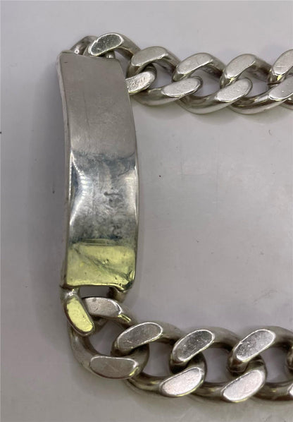 925 silver ID bracelet with a sleek, polished design, featuring a customizable ID plate on a silver chain.