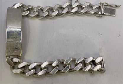 Silver ID bracelet with engraved plate, unbranded 925 sterling silver jewelry, showcasing a sleek, polished design.
