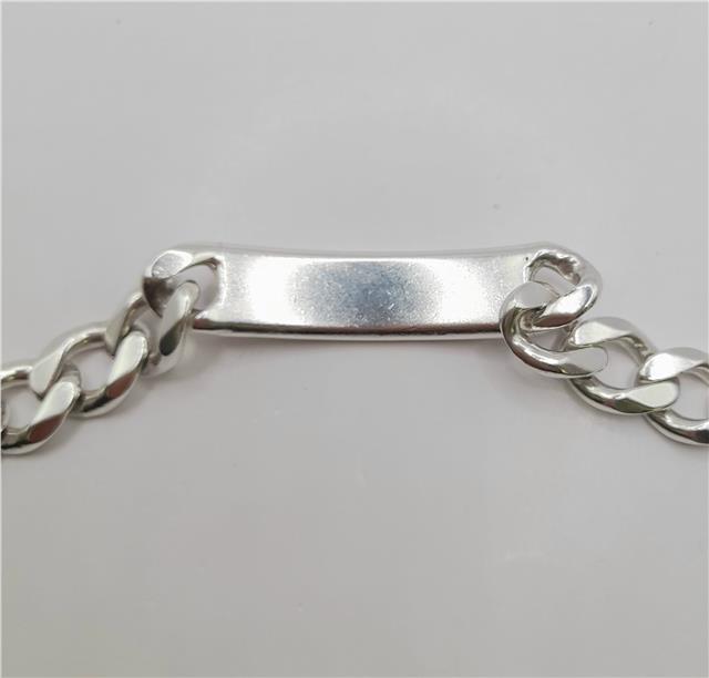 925 silver ID curb bracelet, 22cm, unbranded, with rectangular links and secure clasp, displayed on a neutral background.