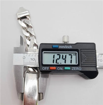 925 silver ID curb bracelet, 22cm, unbranded, with rectangular links and secure clasp, showcasing sleek silver jewelry design.