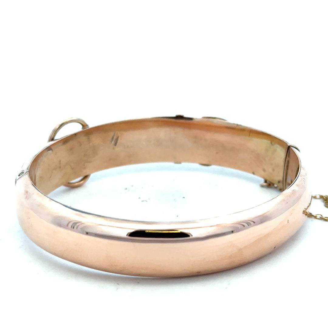 9ct gold bracelet bangle weighing 17.9g, unbranded, with a smooth, polished finish, shown in a close-up image.