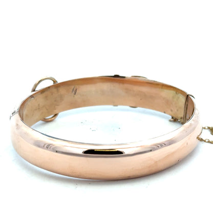 9ct gold bracelet bangle weighing 17.9g, unbranded, with a smooth, polished finish, shown in a close-up image.