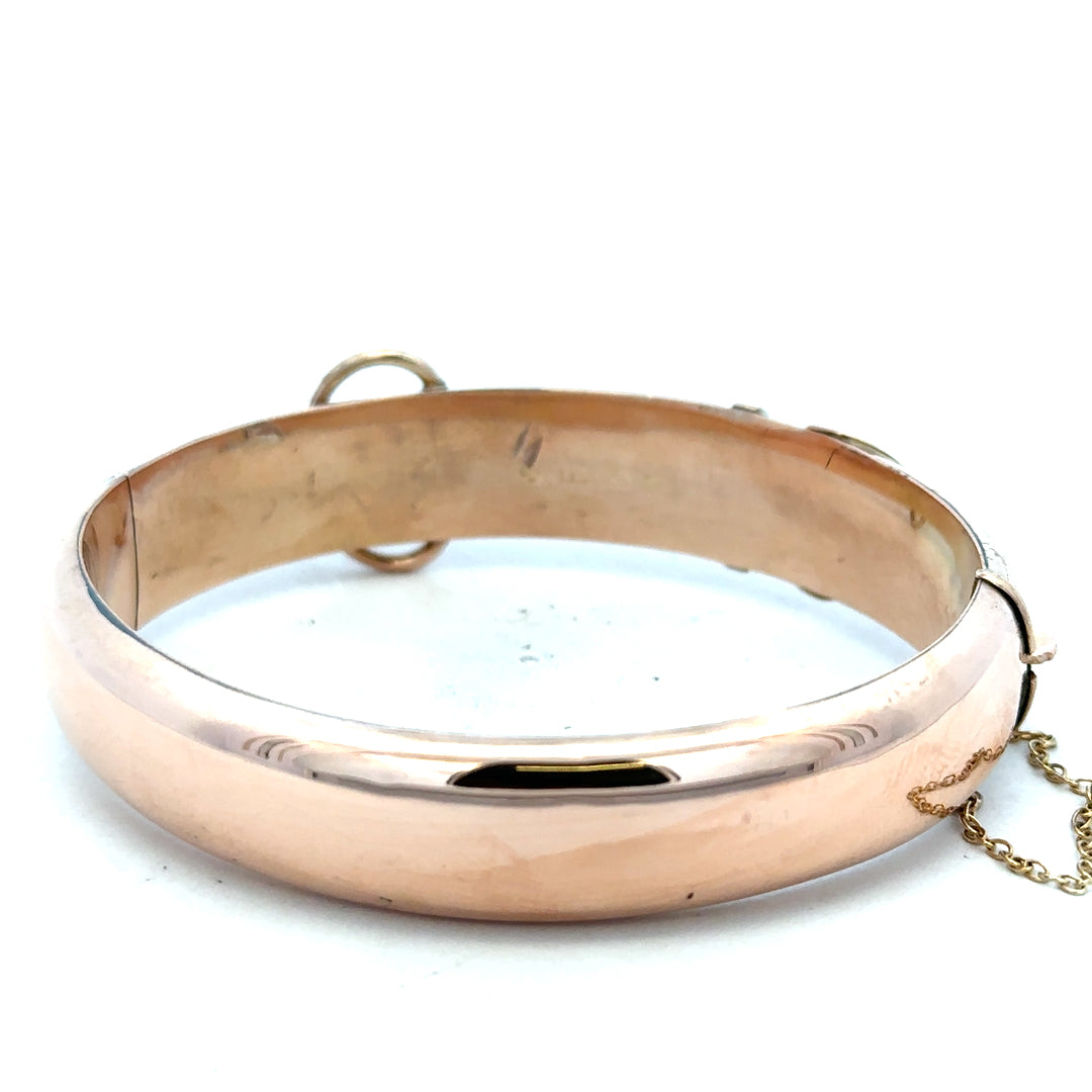 9ct gold bracelet with a sleek design, weighing 17.9 grams, showcasing a stylish unbranded bangle on a neutral background.
