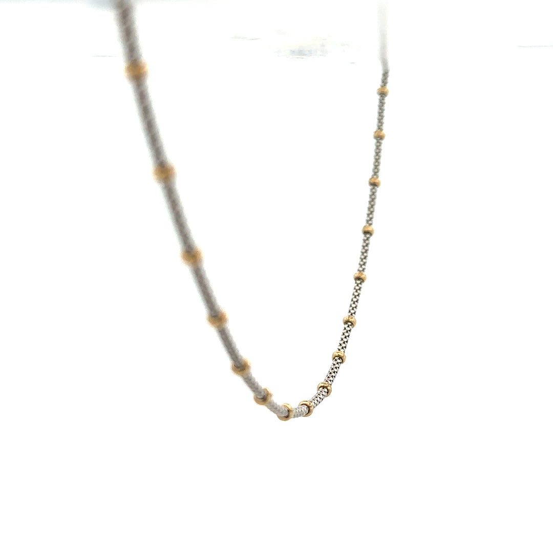 9ct gold chain weighing 5.6g, featuring a classic link design, unbranded jewelry piece with a polished finish.
