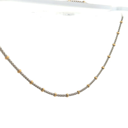 Unbranded 9ct gold chain weighing 5.6g, with a simple and elegant design, shown in a close-up view.