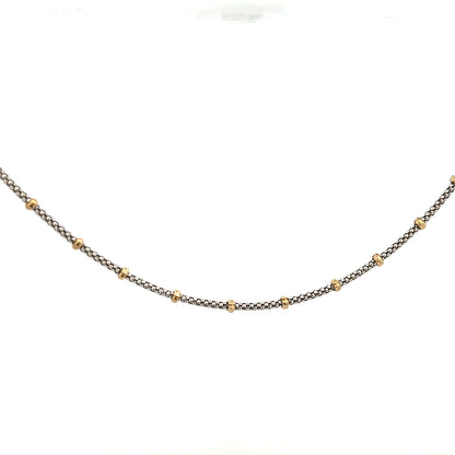 Close-up of a 9ct gold chain weighing 5.6g, featuring a classic link design, unbranded.