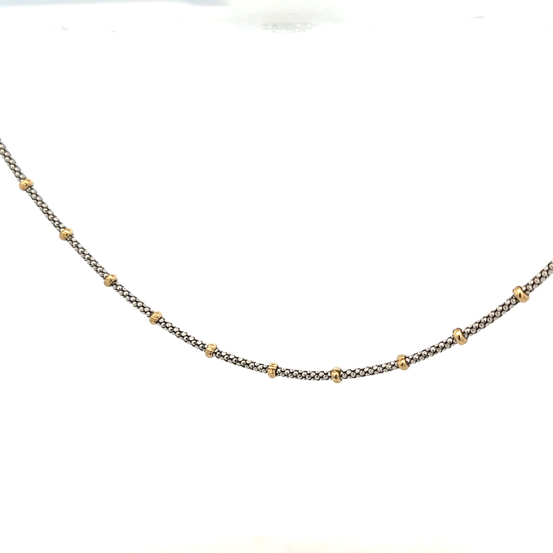 9ct gold chain weighing 5.6g, unbranded, with a detailed chain link design visible in the image.