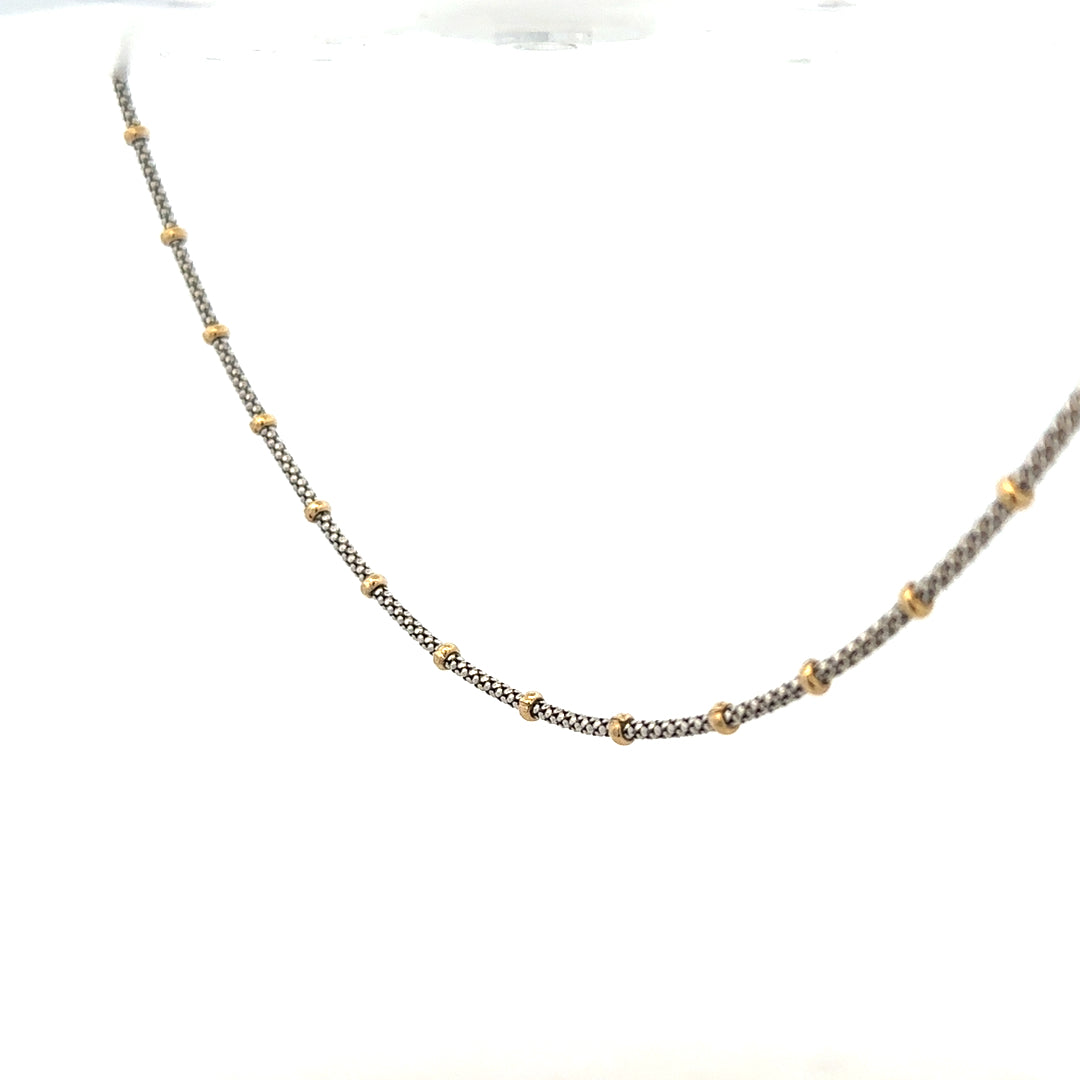 9ct gold chain weighing 5.6g, unbranded, with a classic link design, shown in a close-up view highlighting its shine and craftsmanship.