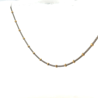 9ct gold chain weighing 5.6g, unbranded, with a classic link design, shown in a close-up view highlighting its shine and craftsmanship.