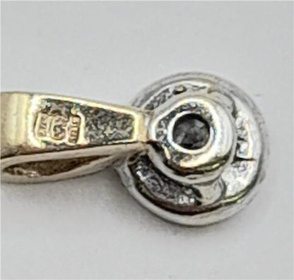 9ct gold diamond pendant with sparkling diamonds, unbranded jewelry piece, weighs 0.7g, elegant and classic design.