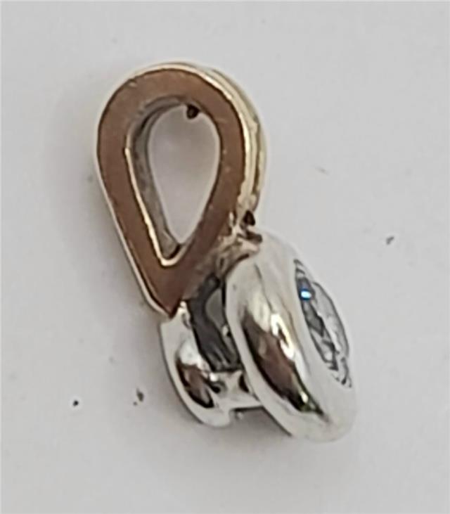 9ct gold diamond pendant with sparkling diamonds, unbranded, weighing 0.7g, elegant jewelry piece with detailed craftsmanship.