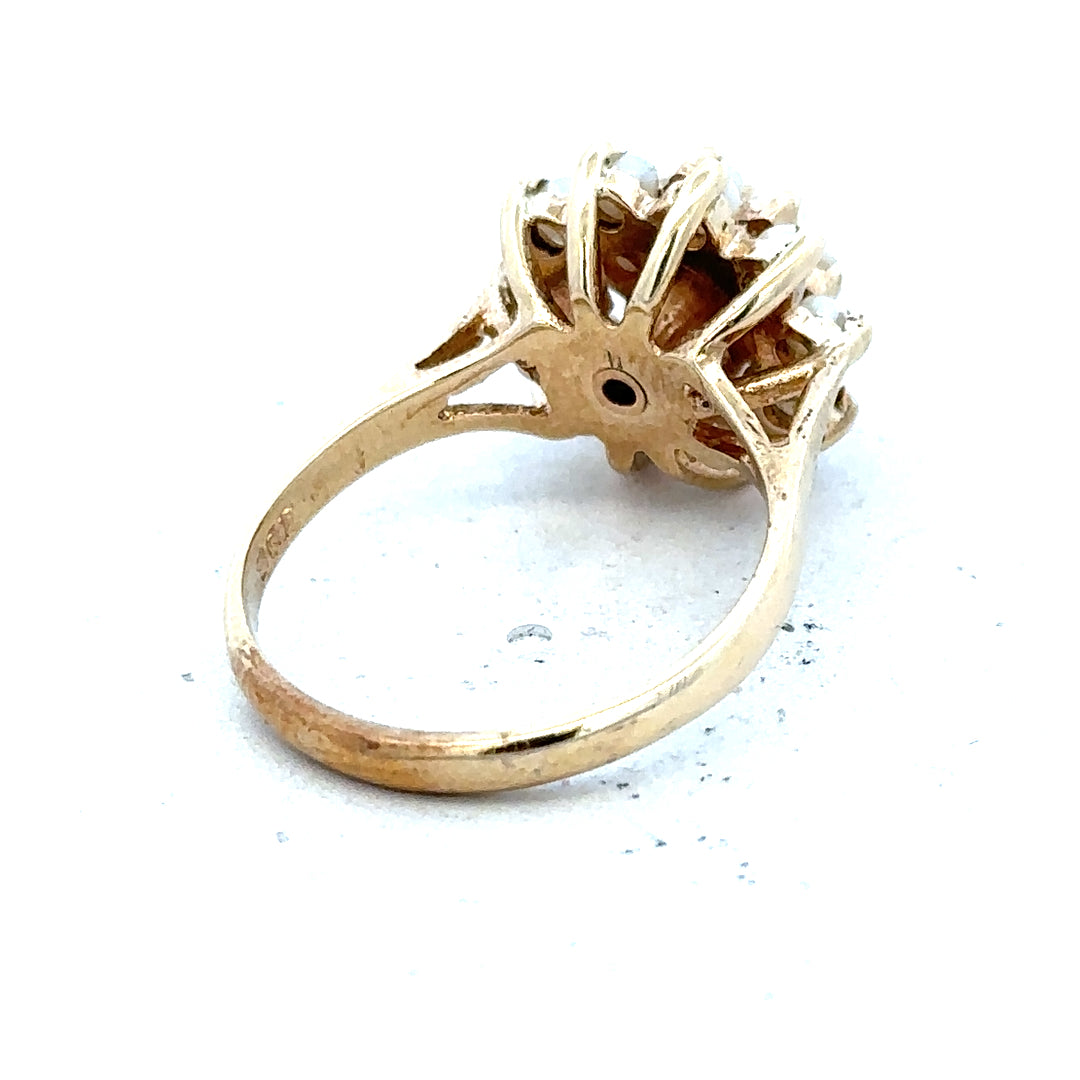 9ct gold diamond ring with a sparkling central diamond and a sleek band, unbranded jewelry design.