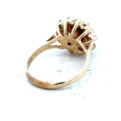 9ct gold diamond ring with a sparkling central diamond and a sleek band, unbranded jewelry design.