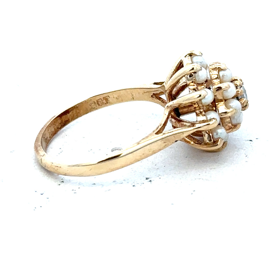 9ct gold diamond ring featuring a sparkling central diamond and a sleek gold band, unbranded jewelry accessory.