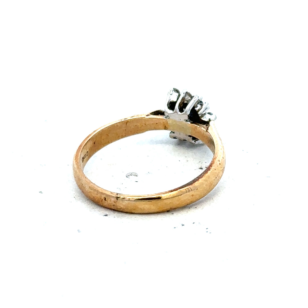 9ct gold diamond ring showcasing a sparkling diamond set in a simple gold band. Elegant jewelry piece for special occasions.