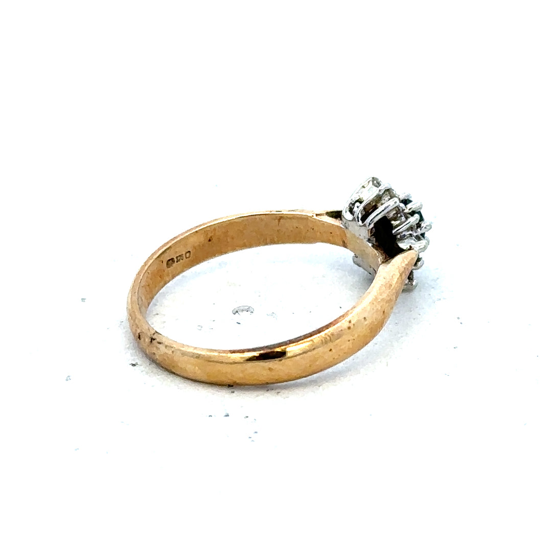 9ct gold diamond ring with a sparkling central diamond and elegant band, unbranded jewelry piece.