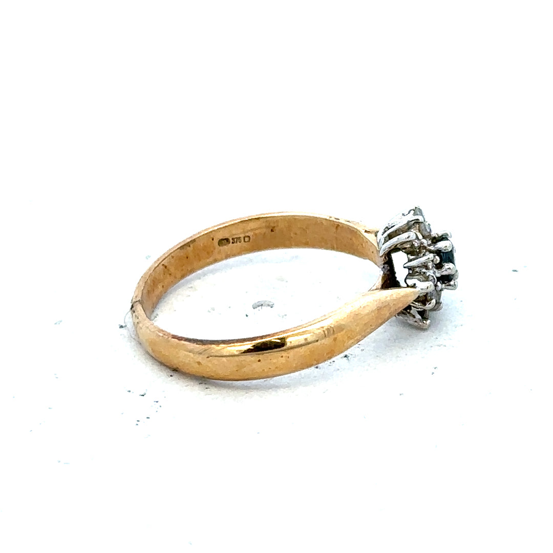 9ct gold diamond ring featuring a sparkling central diamond and a sleek band, showcasing elegant jewelry design.