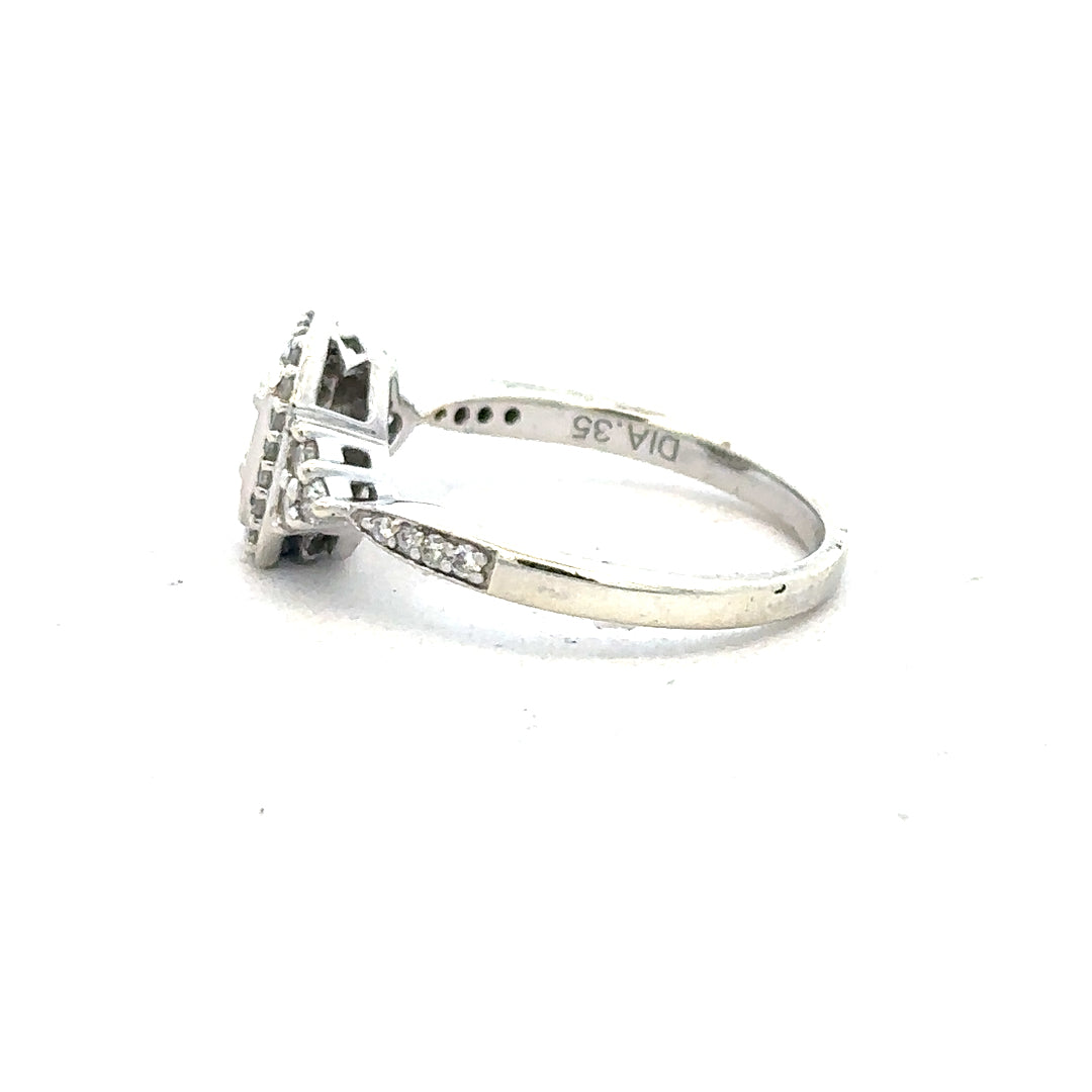 9ct white gold diamond ring with 0.35 carats, size J, featuring a sparkling central diamond and elegant band design.
