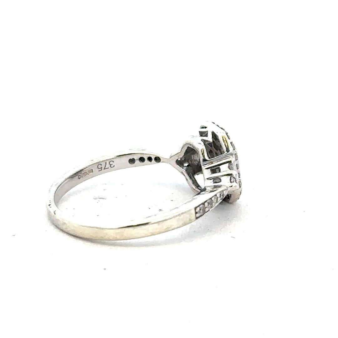 9ct white gold diamond ring with 0.35 carats, size J, featuring a sparkling central diamond and elegant band design.