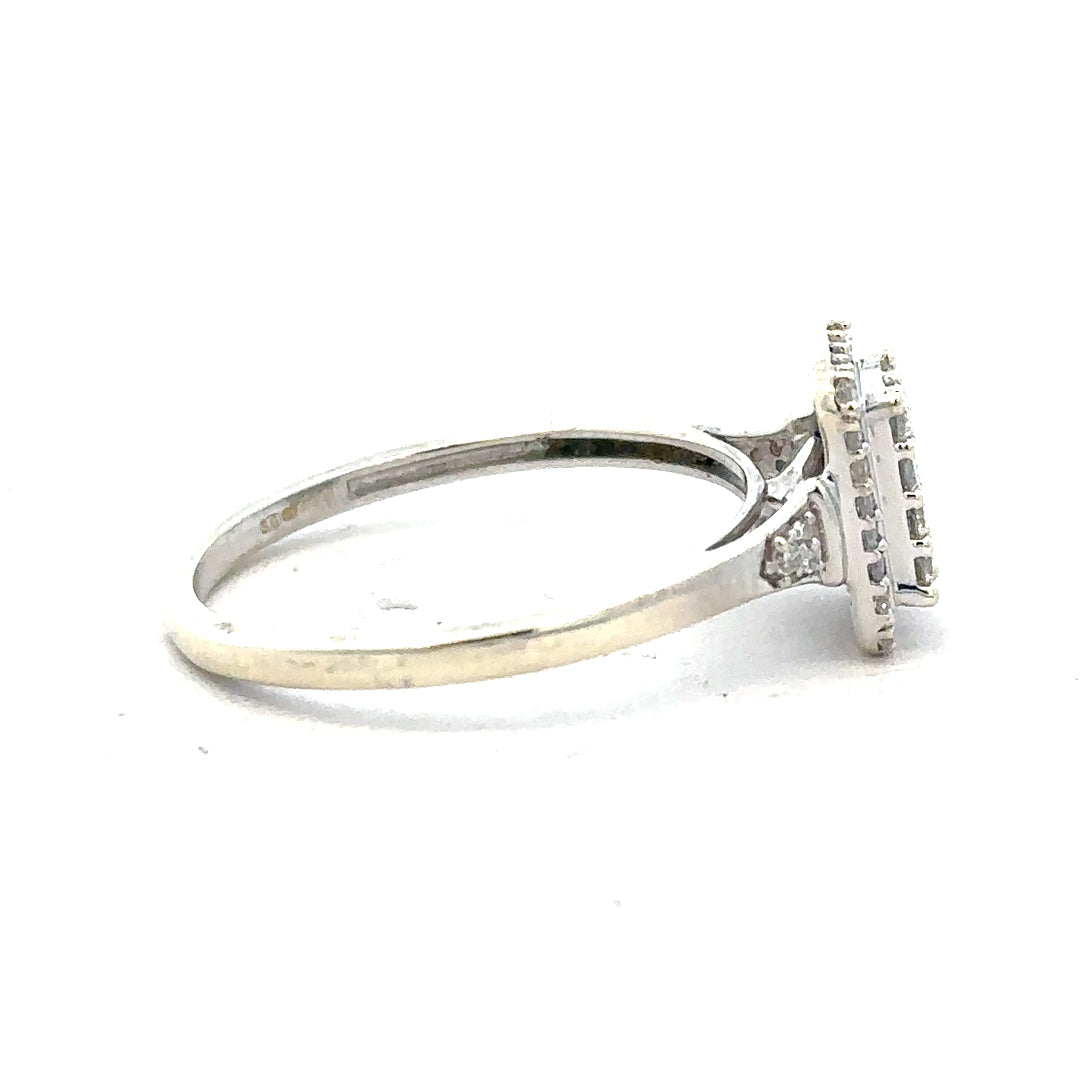 9ct white gold diamond ring with 0.36 carats, size S, featuring a sparkling central diamond and elegant design.