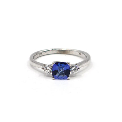 9ct white gold ring featuring a 0.70 carat tanzanite gemstone and diamond accents, showcasing elegant jewelry design.