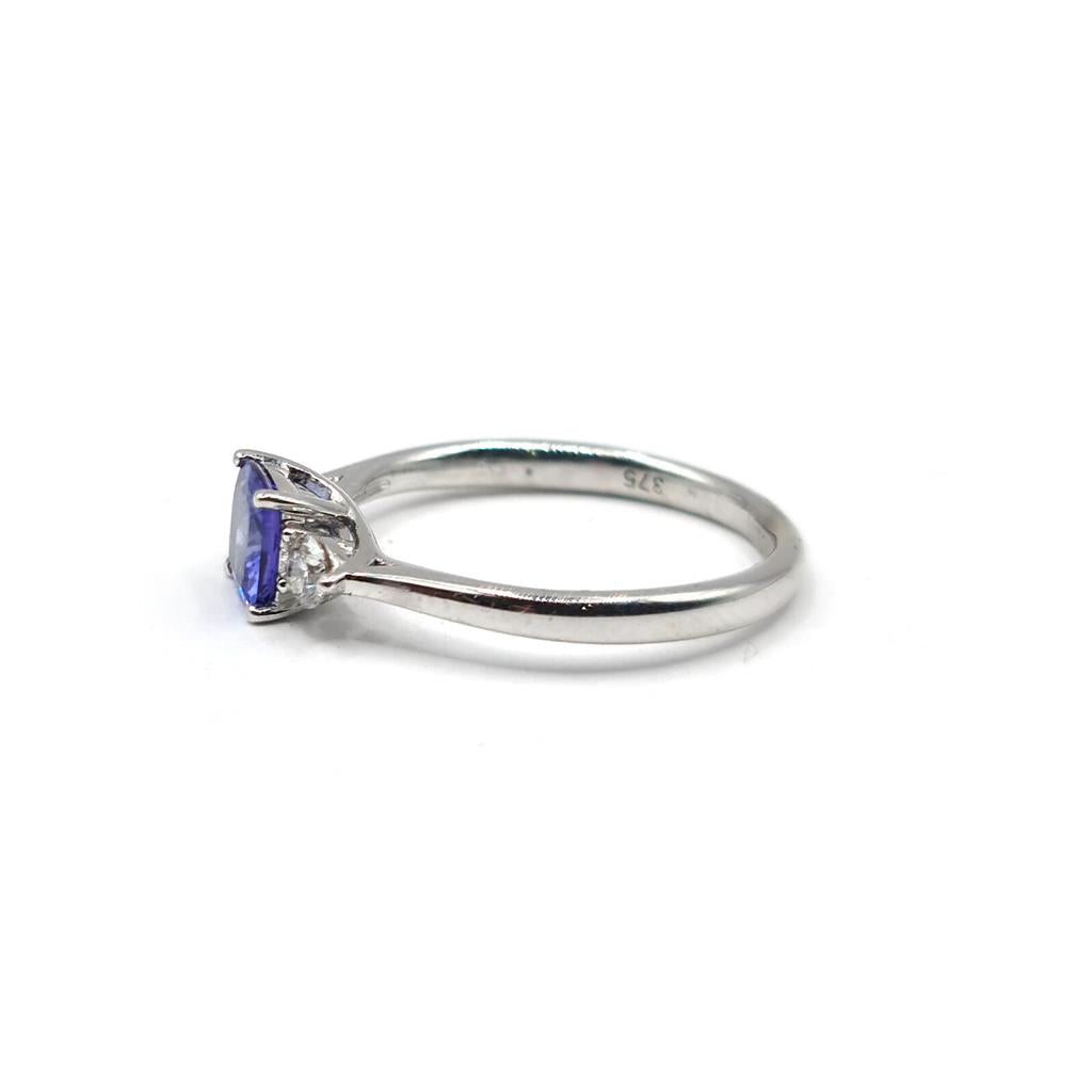9ct white gold ring featuring a 0.70 carat tanzanite gemstone and diamond accents, elegant jewelry piece.