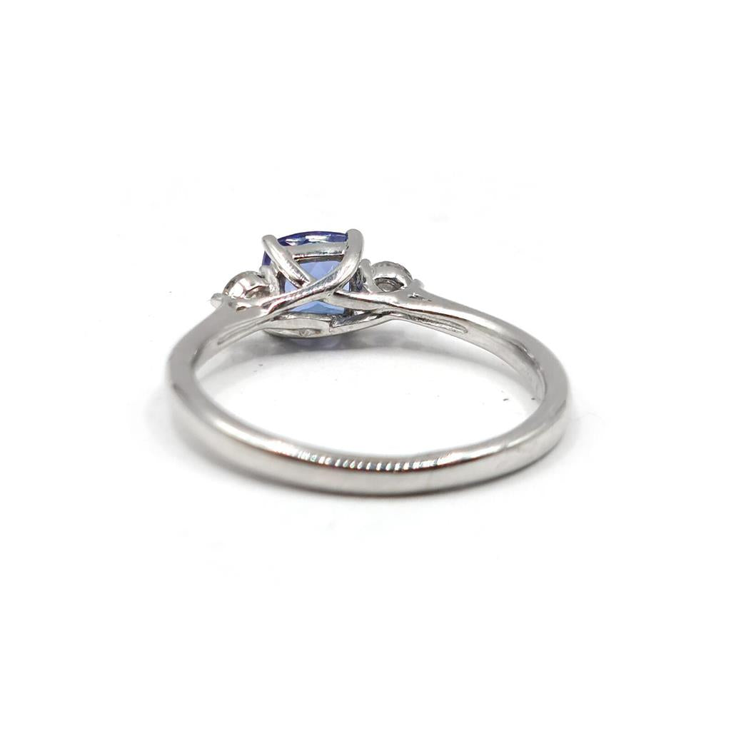 9ct white gold ring with 0.70 carat tanzanite and diamond accents, showcasing a elegant and sparkling jewelry design.