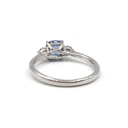 9ct white gold ring with 0.70 carat tanzanite and diamond accents, showcasing a elegant and sparkling jewelry design.