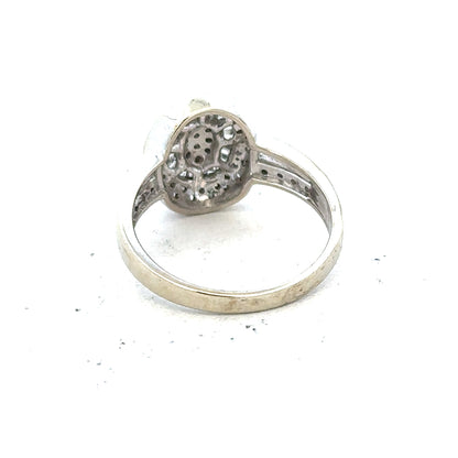 9ct white gold diamond ring with 1/2 carat center stone, size P, featuring a sleek band and sparkling diamond details.