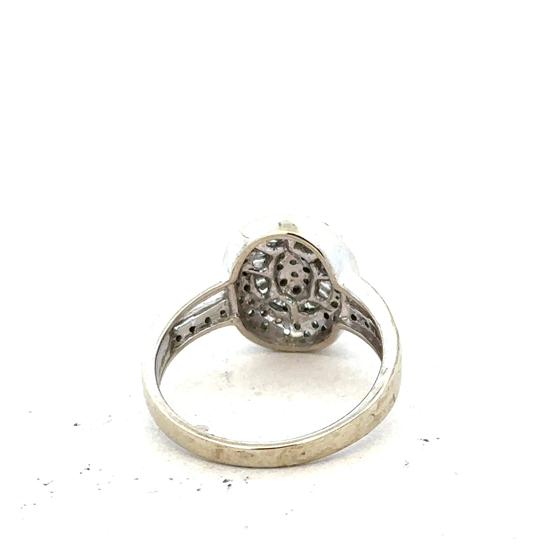 9ct white gold diamond ring with 1/2 carat center stone in size P, featuring a sleek band and sparkling diamonds.