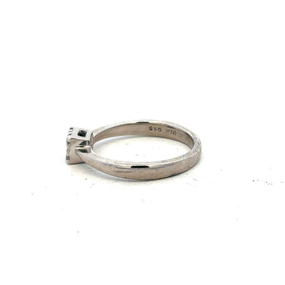 9ct white gold diamond ring with 15pts of diamonds in size K1/2, featuring a sleek and elegant design.