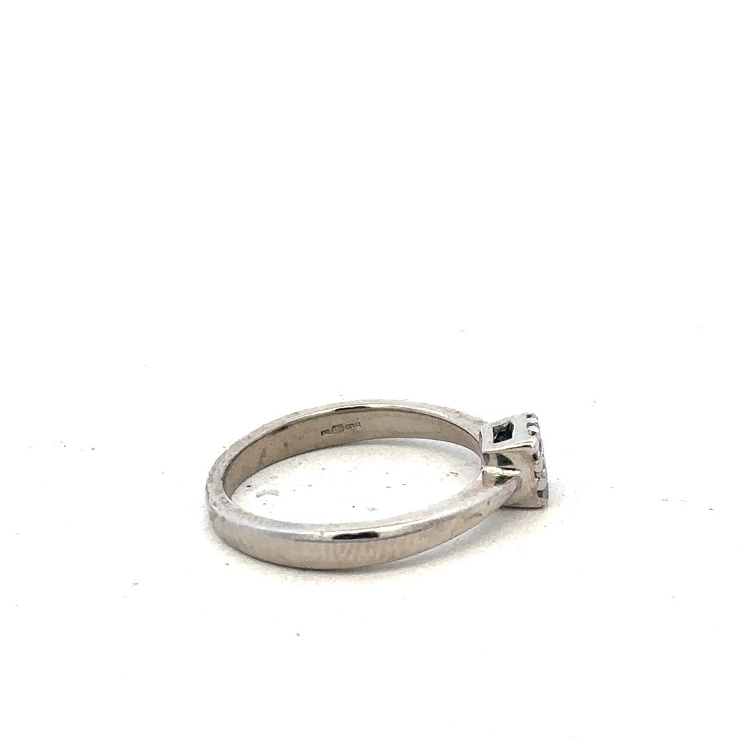 9ct white gold diamond ring with 15pts of diamonds in size K1/2, showcasing a sleek and elegant design.